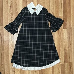 Black and white square pattern Dress. It has a collar, with lace details